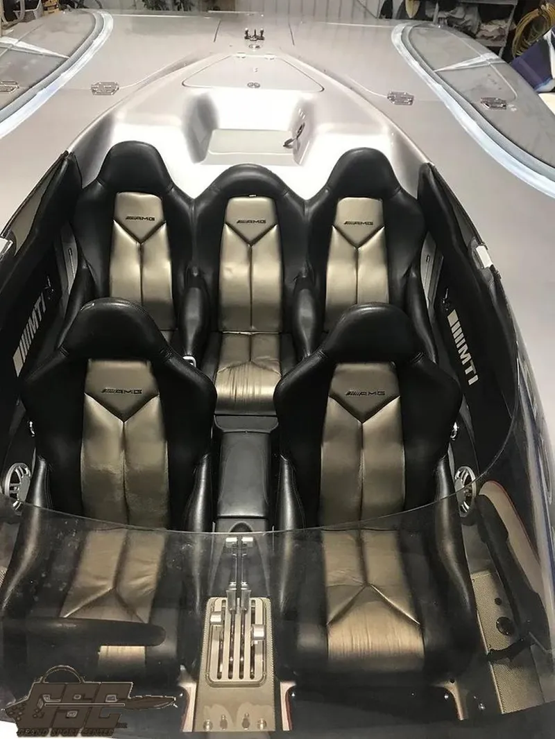 Slide: The Image of 2007 MTI 44 AMG TRIBUTE boat interior with four black and silver seats. - 47