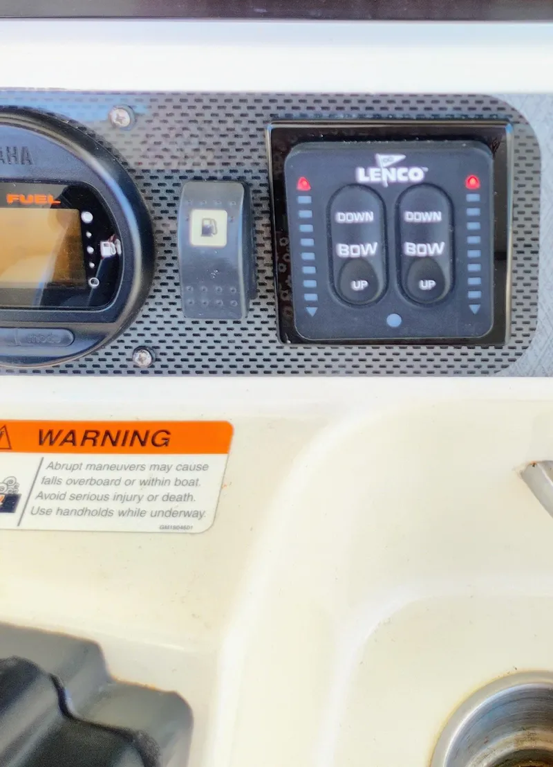 Slide: The Image of Control panel of a 2008 Hydra-Sports Vector 2900 CC boat with Lenco trim tab switches. - 18