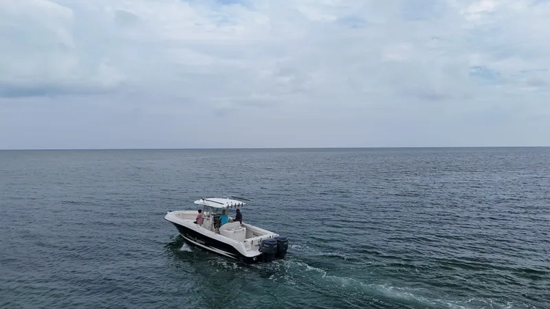 Slide: The Image of 2008 Hydra-Sports Vector 2900 CC cruising on open sea under cloudy sky. - 2