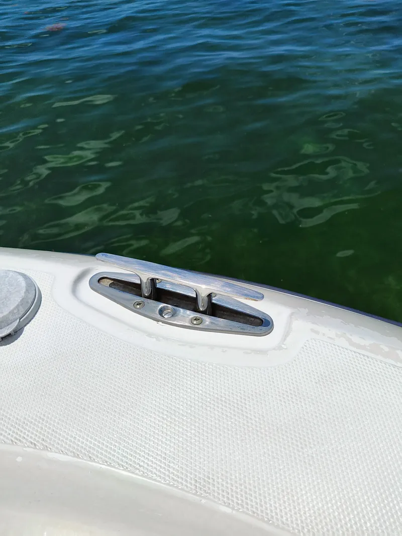 Slide: The Image of Close-up of 2008 Hydra-Sports Vector 2900 CC boat cleat on water. - 23