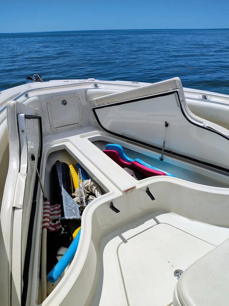Slide: The Image of 2008 Hydra-Sports Vector 2900 CC boat with open storage compartments on the ocean. - 28