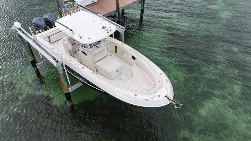 Slide: The Image of 2008 Hydra-Sports Vector 2900 CC boat docked above clear water. - 3