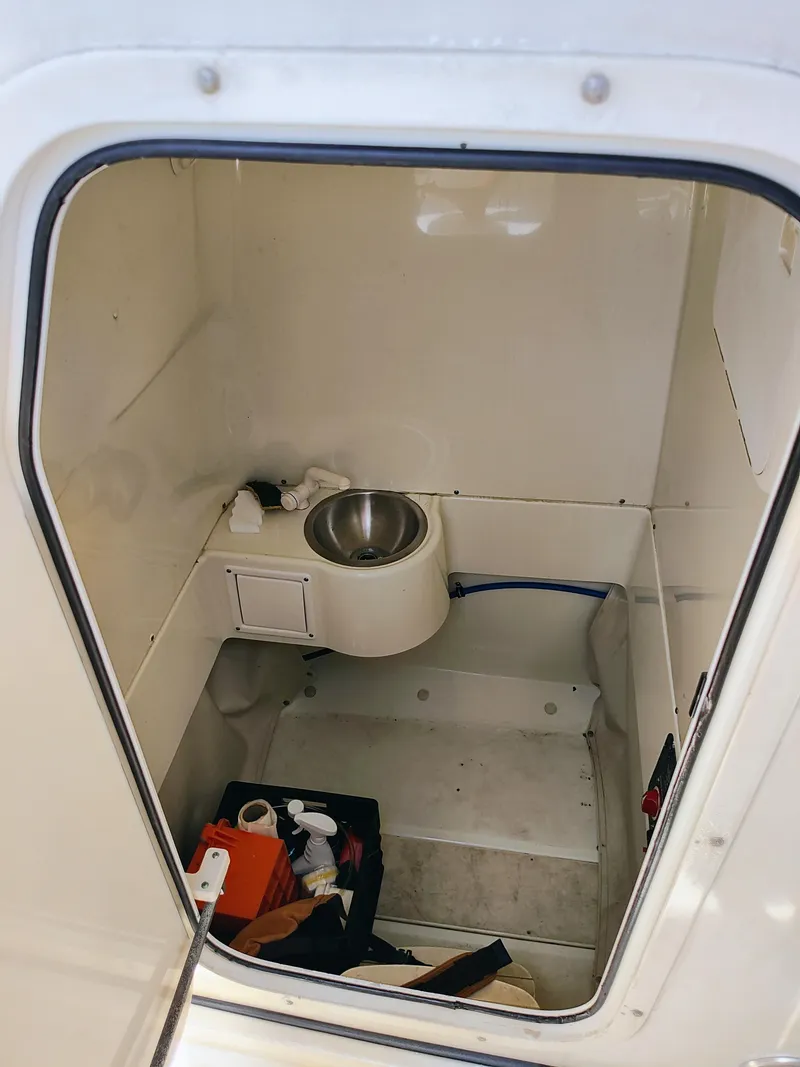 Slide: The Image of 2008 Hydra-Sports Vector 2900 CC interior cabin with sink and storage. - 39