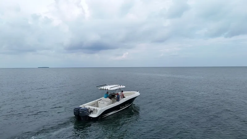 Slide: The Image of 2008 Hydra-Sports Vector 2900 CC boat cruising on open water under cloudy sky. - 4