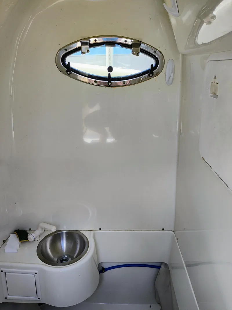 Slide: The Image of 2008 Hydra-Sports Vector 2900 CC interior cabin with sink and porthole window. - 43