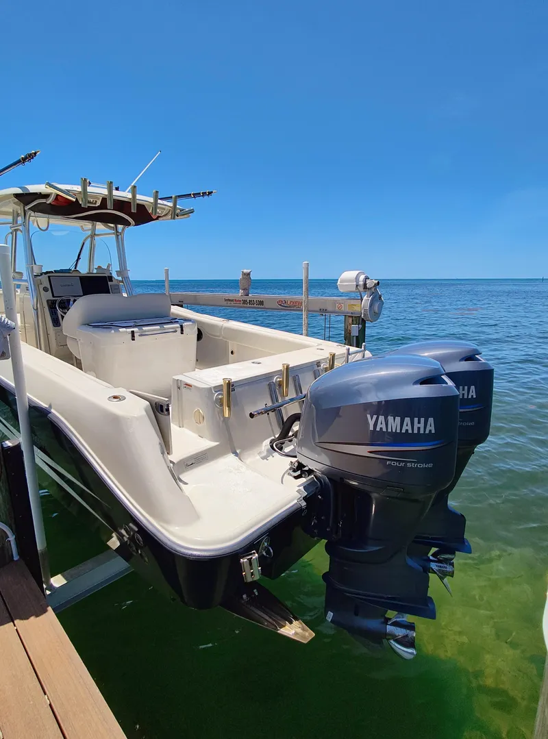 Slide: The Image of 2008 Hydra-Sports Vector 2900 CC boat with twin Yamaha outboard engines docked by the sea. - 8