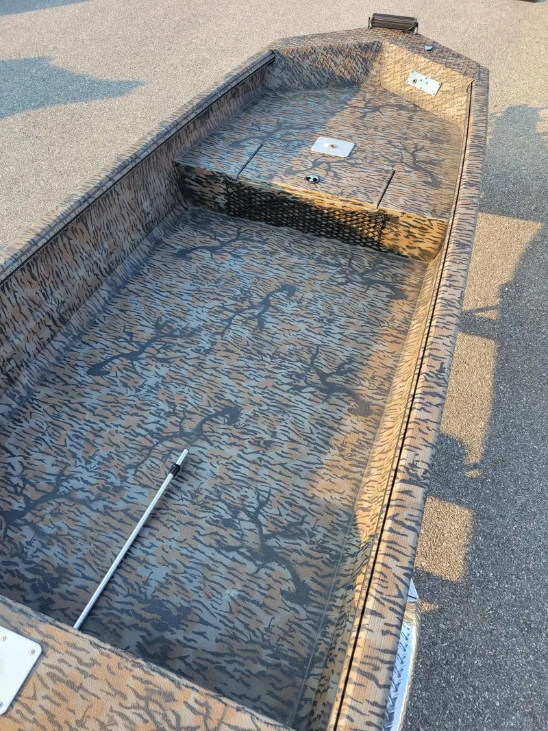 Slide: The Image of 2026 Xpress XTS16 duck hunting boat with camouflage interior, awaiting July delivery. - 9