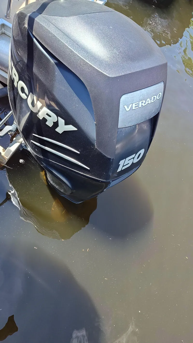 Slide: The Image of Mercury Verado 150 outboard motor on a 2011 South Bay 722CR boat. - 8