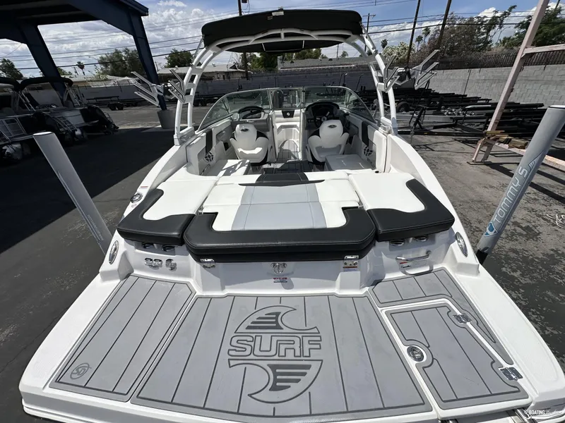 Slide: The Image of 2022 Chaparral 23 Surf boat, rear view with seating and deck. - 12