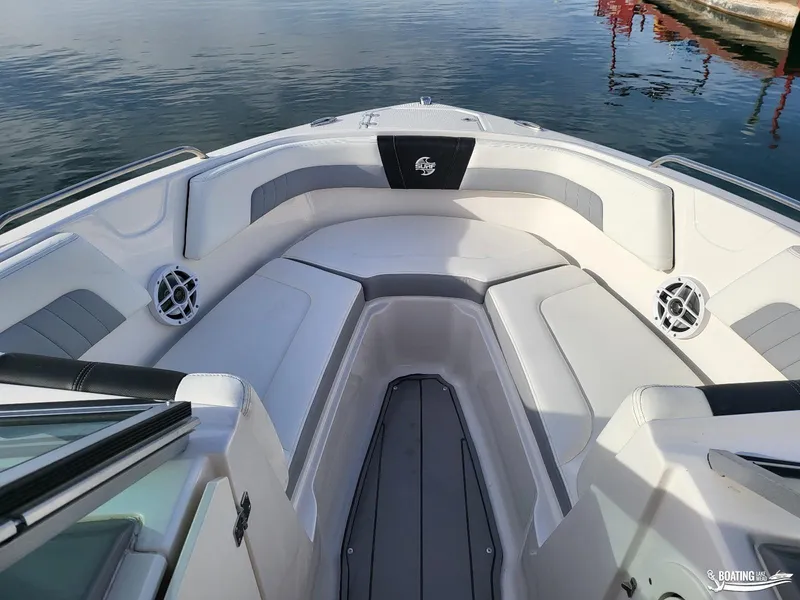 Slide: The Image of 2022 Chaparral 23 Surf boat interior with spacious seating and sleek design. - 22