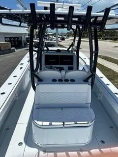 Slide: The Image of 2024 Yellowfin 32CC Offshore center console boat with seating and rod holders. - 4