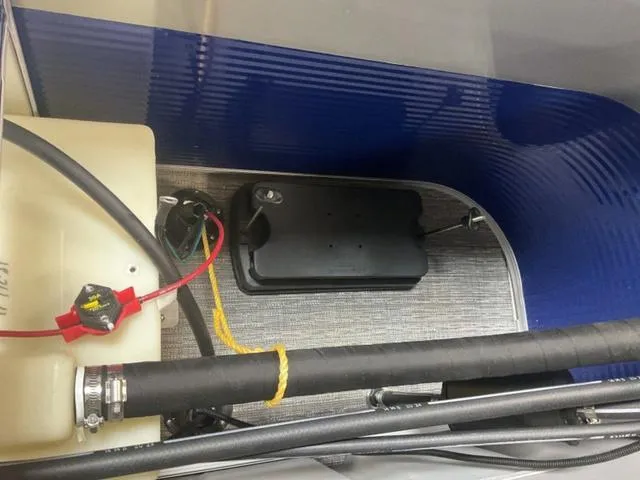 Slide: The Image of 2025 Bennington 188 SVL boat interior wiring and battery compartment. - 11