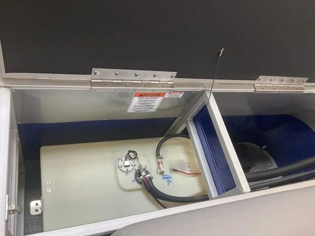 Slide: The Image of 2025 Bennington 188 SVL boat storage compartment with fuel tank and wiring. - 12