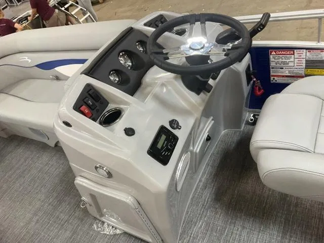 Slide: The Image of 2025 Bennington 188 SVL boat dashboard with steering wheel and controls. - 14