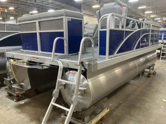Slide: The Image of 2025 Bennington 188 SVL pontoon boat in a warehouse setting. - 5