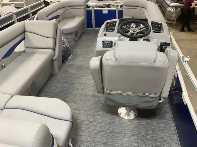 Slide: The Image of 2025 Bennington 188 SVL pontoon boat interior with plush seating and modern helm. - 9