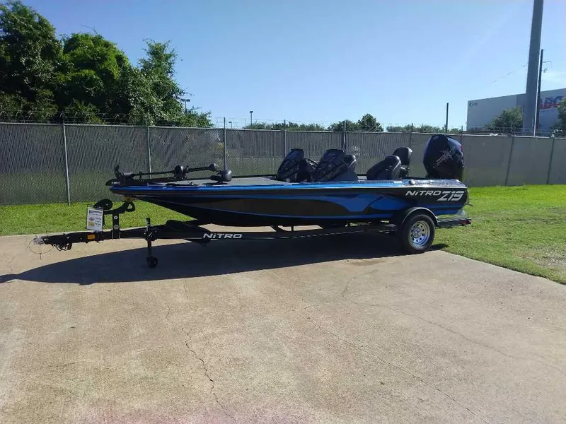 Slide: The Image of 2024 Nitro Z19 fishing boat parked on a concrete surface. - 0