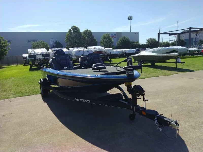 Slide: The Image of 2024 Nitro Z19 boat on display at a dealership. - 2