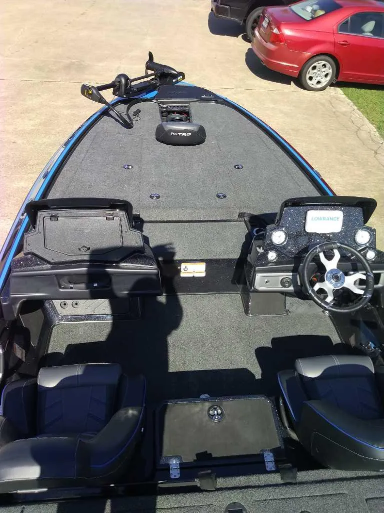 Slide: The Image of 2024 Nitro Z19 fishing boat interior with steering console and seating. - 5