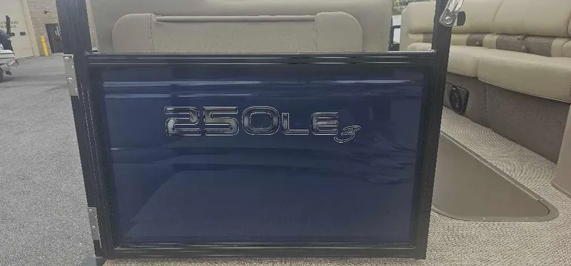 Slide: The Image of 2024 Regency 250 LE3 pontoon boat interior with model name displayed. - 2