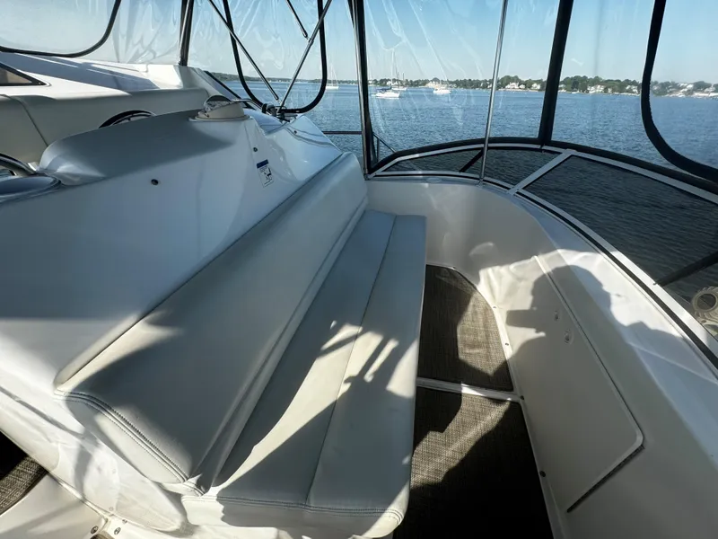 Slide: The Image of 1999 Silverton 392 Motor Yacht interior with seating and panoramic water view. - 10