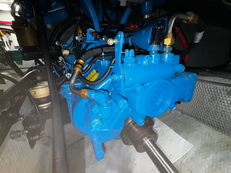 Slide: The Image of Engine compartment of a 1999 Silverton 392 Motor Yacht with blue machinery. - 28
