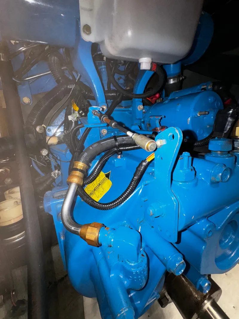 Slide: The Image of Engine compartment of a 1999 Silverton 392 Motor Yacht with blue components. - 29
