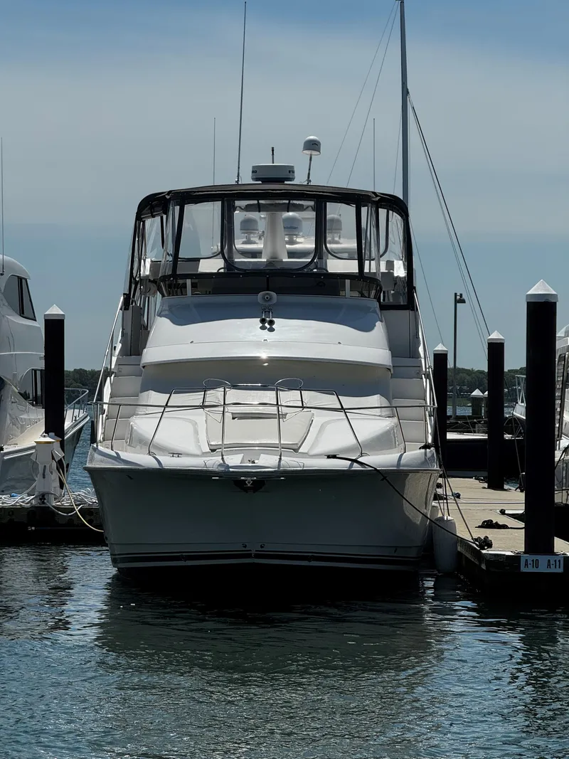 Slide: The Image of 1999 Silverton 392 Motor Yacht docked at a marina. - 3