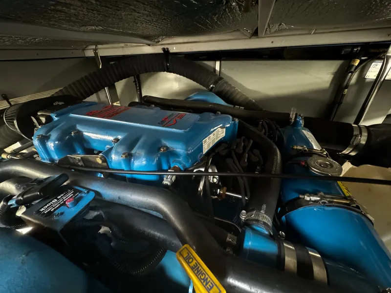 Slide: The Image of 1999 Silverton 392 Motor Yacht engine compartment with blue engine components. - 31