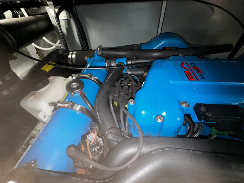 Slide: The Image of 1999 Silverton 392 Motor Yacht engine compartment with blue V8 engine. - 33