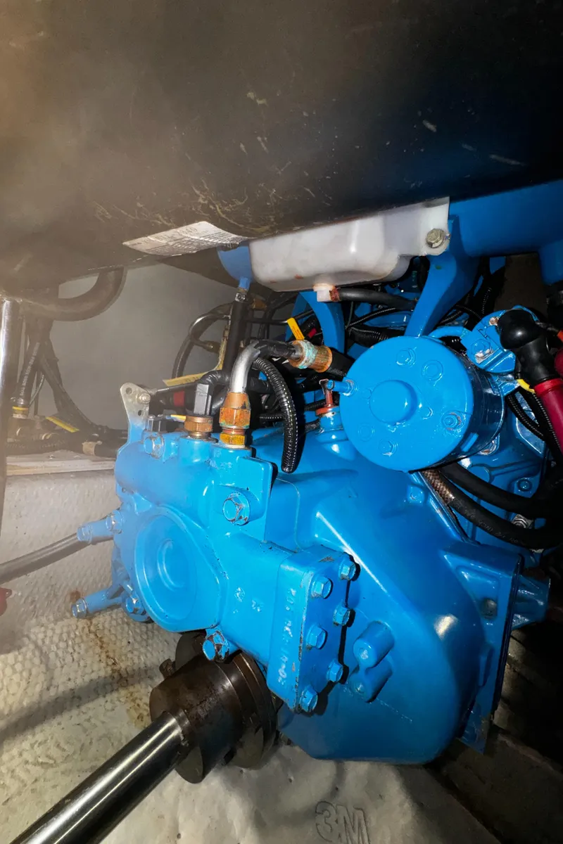 Slide: The Image of Engine compartment of a 1999 Silverton 392 Motor Yacht with blue machinery. - 34