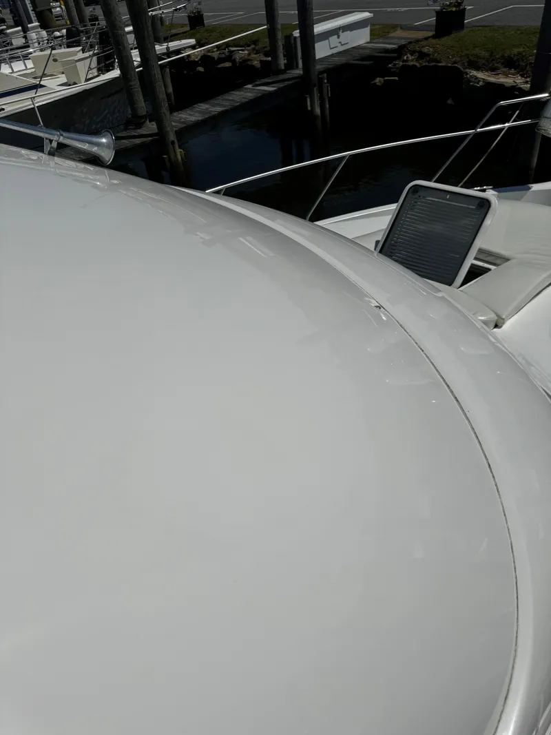 Slide: The Image of 1999 Silverton 392 Motor Yacht deck view at marina. - 5