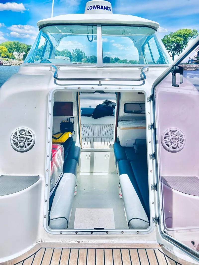 Slide: The Image of Interior view of 2005 Protector 28 Targa boat with seating and open cabin. - 4