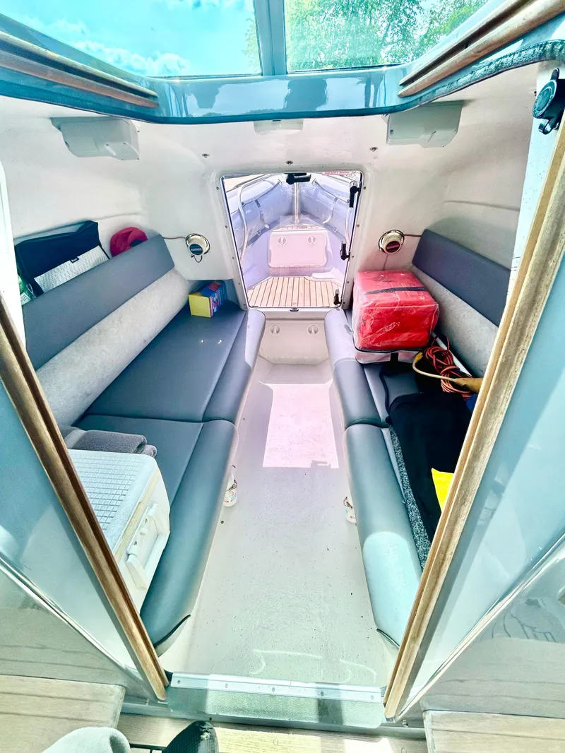 Slide: The Image of Interior of 2005 Protector 28 Targa boat with seating and storage. - 5