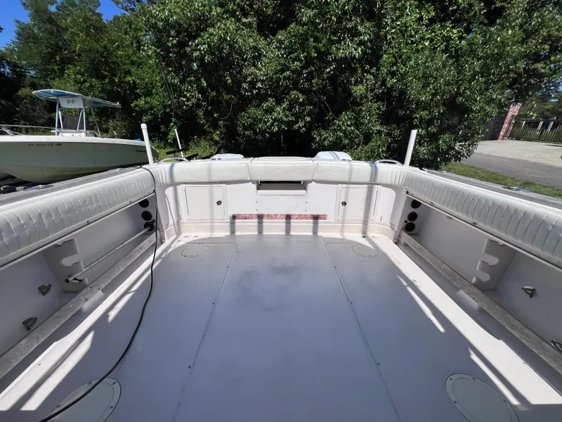 Slide: The Image of 1998 Grady-White F-26 Tigercat boat interior with spacious deck and seating. - 11