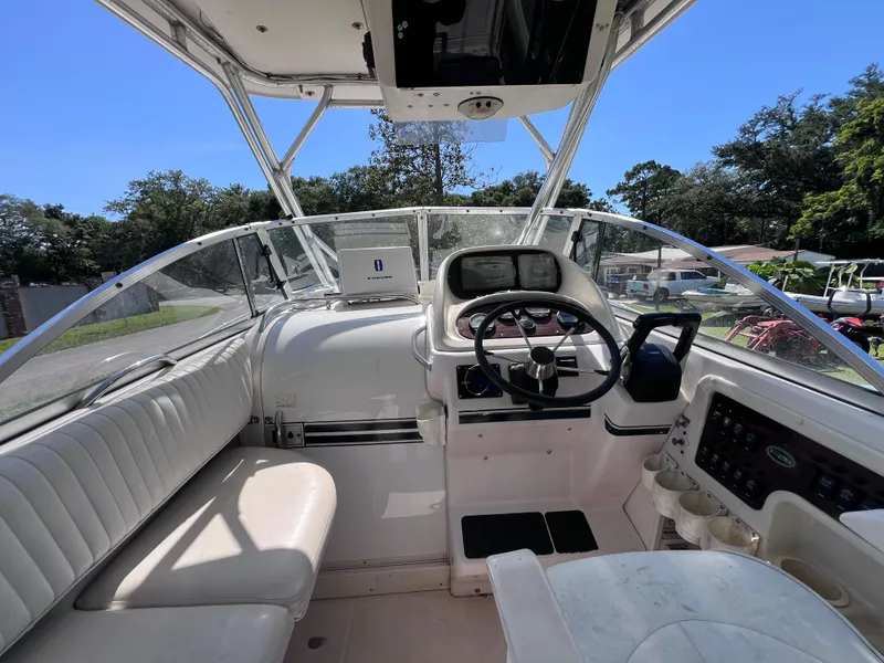 Slide: The Image of 1998 Grady-White F-26 Tigercat boat cockpit with steering wheel and seating. - 12
