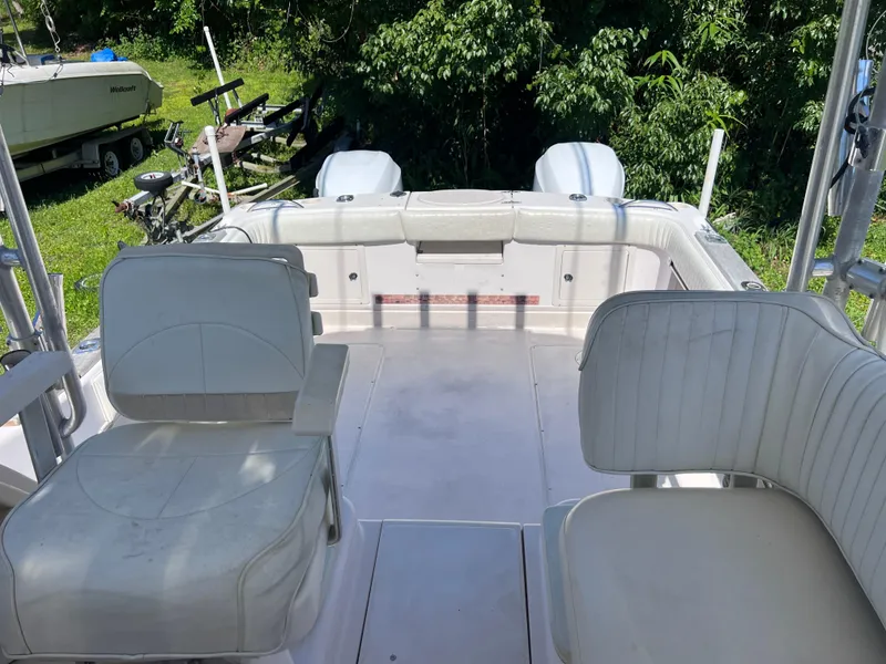 Slide: The Image of 1998 Grady-White F-26 Tigercat boat interior with seating and twin engines. - 17