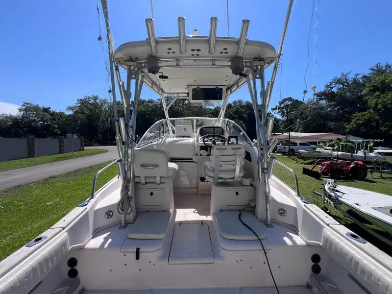 Slide: The Image of 1998 Grady-White F-26 Tigercat boat interior with seating and steering console. - 20