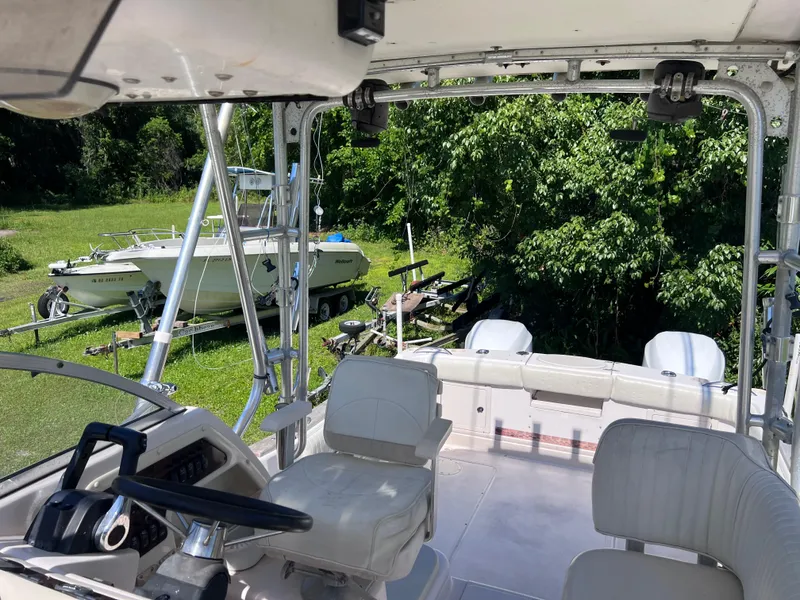 Slide: The Image of 1998 Grady-White F-26 Tigercat boat interior with dual seats and steering wheel. - 28