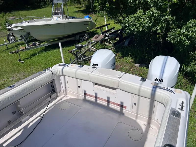 Slide: The Image of 1998 Grady-White F-26 Tigercat boat with twin 200 HP engines. - 29