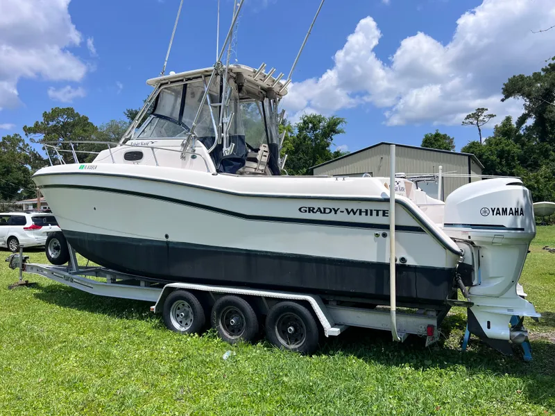 Slide: The Image of 1998 Grady-White F-26 Tigercat boat on a trailer with Yamaha outboard motor. - 3