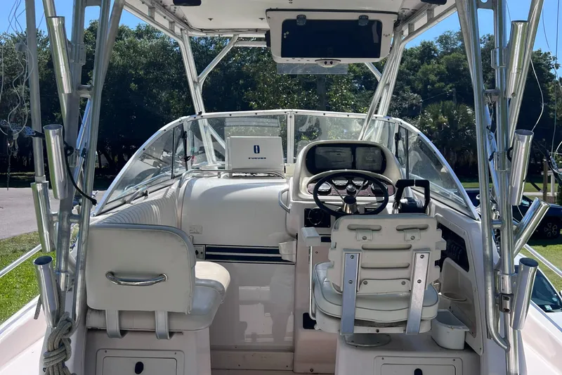 Slide: The Image of 1998 Grady-White F-26 Tigercat boat interior with steering wheel and seating. - 36