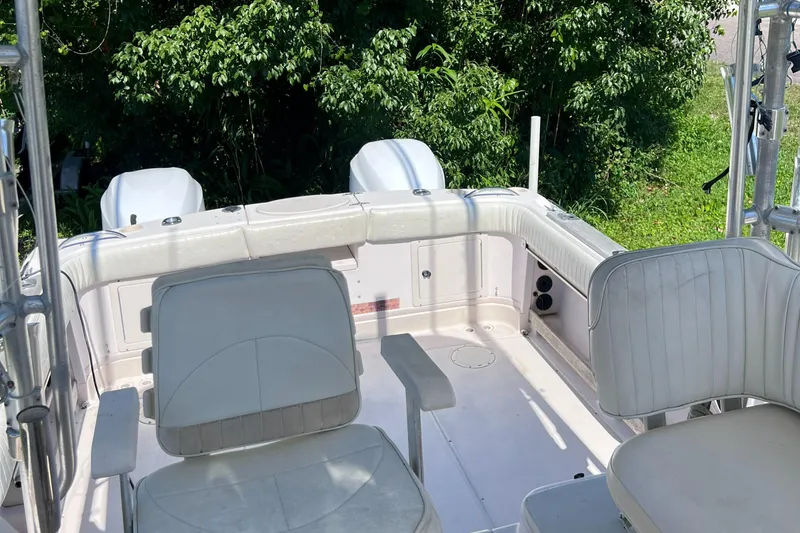 Slide: The Image of 1998 Grady-White F-26 Tigercat boat interior with seating and twin engines. - 37