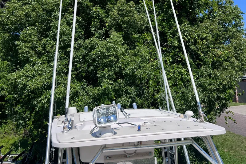 Slide: The Image of 1998 Grady-White F-26 Tigercat boat with fishing rods and spotlight. - 42