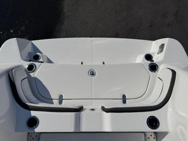 Slide: The Image of 2024 Yamaha Boats 255 FSH Sport H, sleek white deck design, top view. - 28