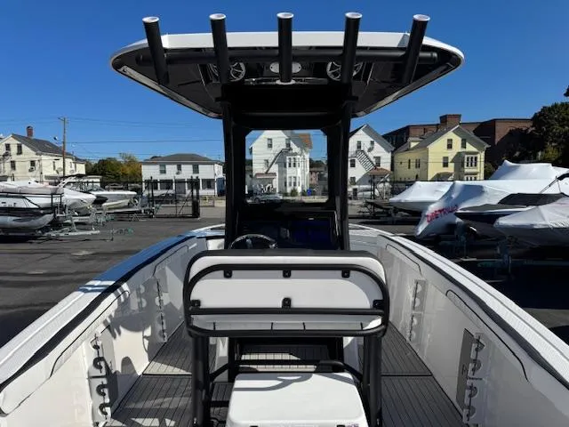 Slide: The Image of 2024 Yamaha Boats 255 FSH Sport H, center console, docked in marina. - 3
