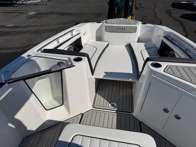 Slide: The Image of 2024 Yamaha Boats 255 FSH Sport H interior, featuring sleek seating and modern design. - 4