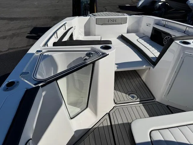 Slide: The Image of 2024 Yamaha Boats 255 FSH Sport H interior, featuring sleek seating and modern design. - 6