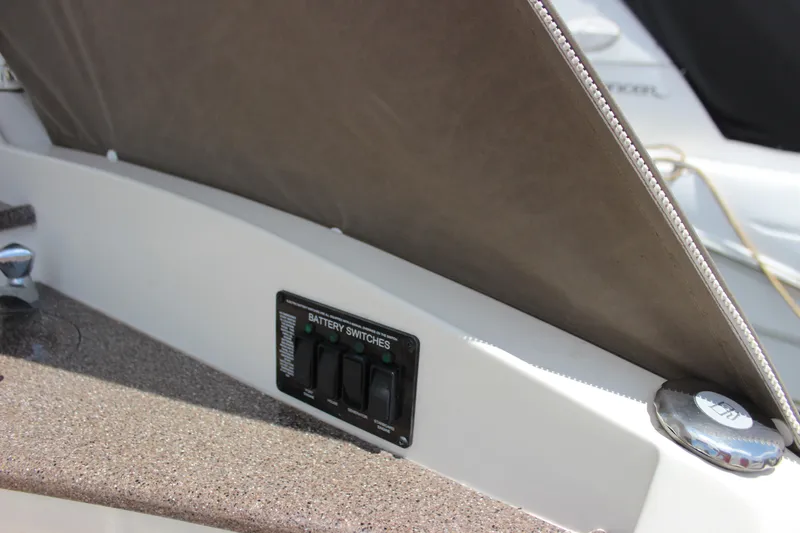 Slide: The Image of Battery switches on a 2013 Rinker 31 boat. - 13