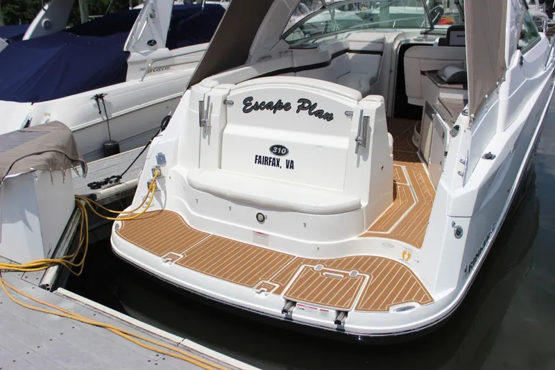 Slide: The Image of 2013 Rinker 31 boat docked, named Escape Plan, with teak deck, Fairfax, VA. - 2